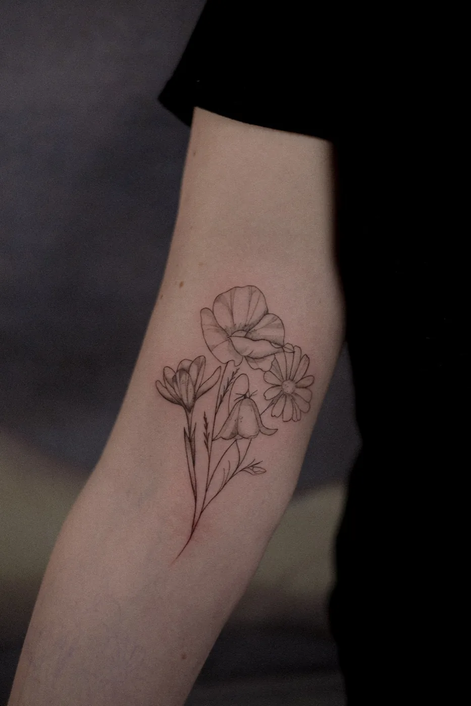 Wildflower bouquet on forearm